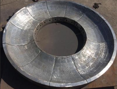 Material baru untuk suku cadang tahan aus di pabrik semen - coran komposit berbasis besi yang diperk